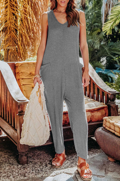 Lässige einfarbige Jumpsuits mit V-Ausschnitt und Tasche in lockerer Passform