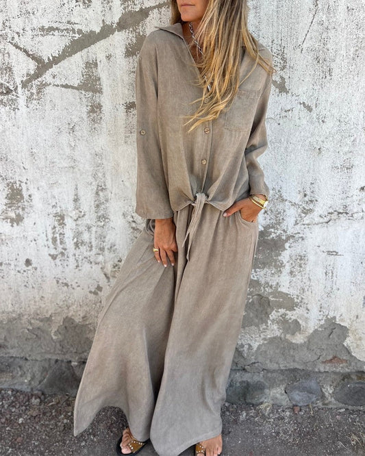 Elegantes Damen-Sommeroutfit mit Baggy-Hose und langärmeliger Bluse mit Knöpfen