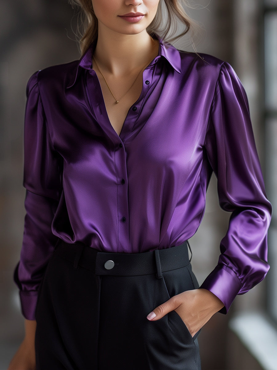 Elegante schwarze Satinbluse mit langen Ärmeln