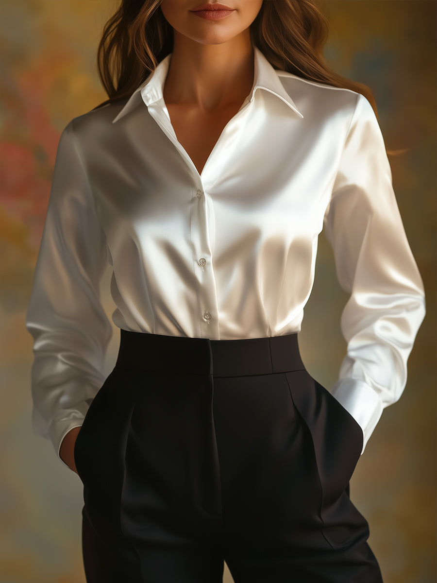 Elegante schwarze Satinbluse mit langen Ärmeln