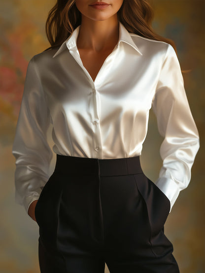Elegante schwarze Satinbluse mit langen Ärmeln