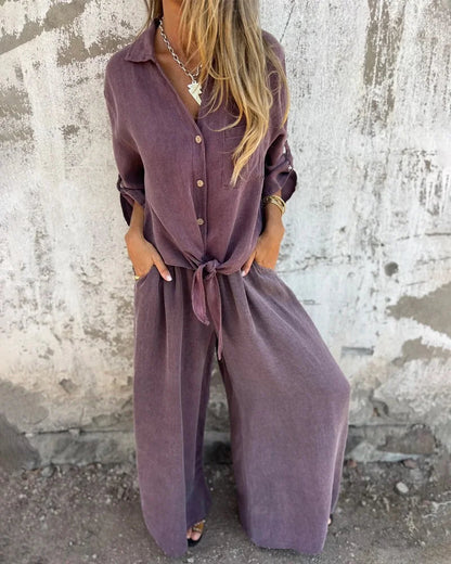 Elegantes Damen-Sommeroutfit mit Baggy-Hose und langärmeliger Bluse mit Knöpfen