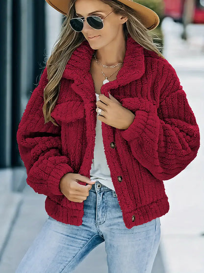 – Einfarbige Pelzjacke