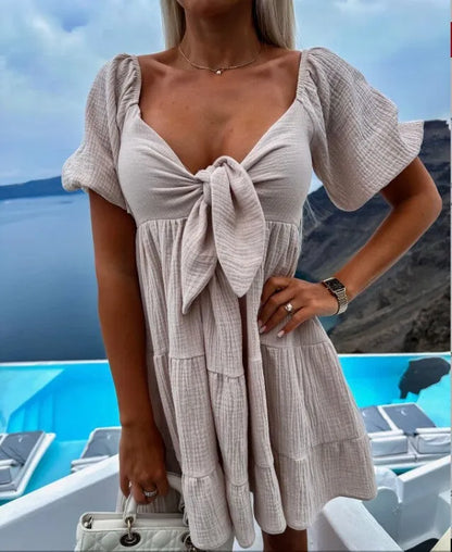 Alaia - Kurzärmeliges Kleid mit V-Ausschnitt und Schleife auf der Brust