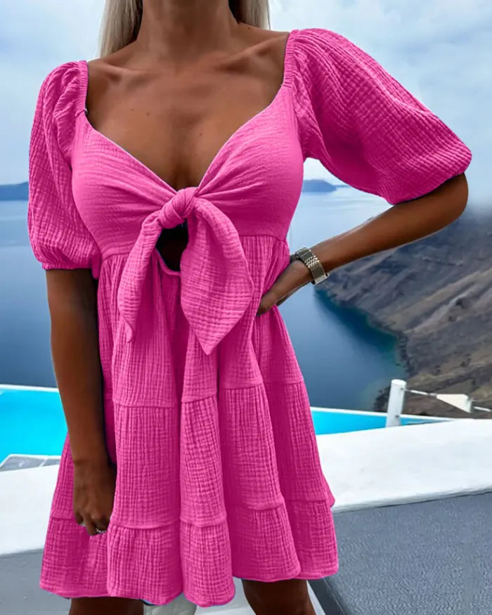 Alaia - Kurzärmeliges Kleid mit V-Ausschnitt und Schleife auf der Brust