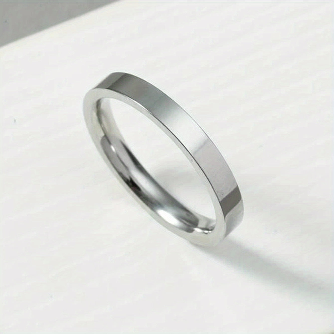 Lotte | Glänzender Edelstahlring mit Bogenmotiv